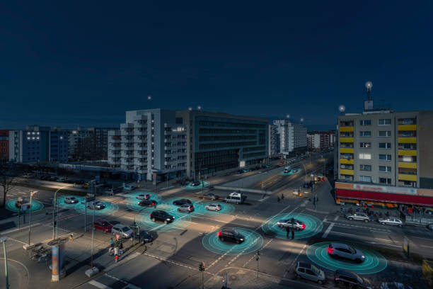 Self Driving Autonomous Cars on City Street at Night stock photo