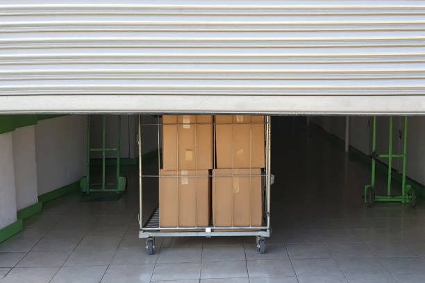 Self storage facility entrance Self storage facility entrance. Trolley cart with boxes self storage stock pictures, royalty-free photos & images