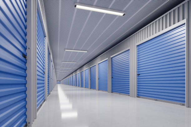 Self Storage Facility Interior of a modern self storage warehouse. storage compartment stock pictures, royalty-free photos & images