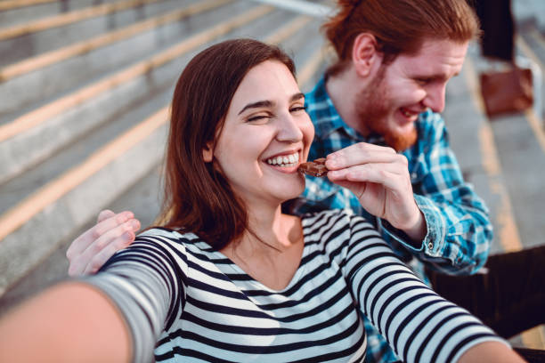 Selfie Of Male Feeding Chocolate To His Girlfriend  couple eating chocolate stock pictures, royalty-free photos & images