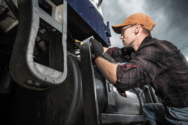 Semi Truck Driver Checking Vehicle Elements stock photo