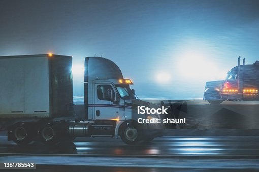 istock Semi Trucks on Highway in Winter 1361785543