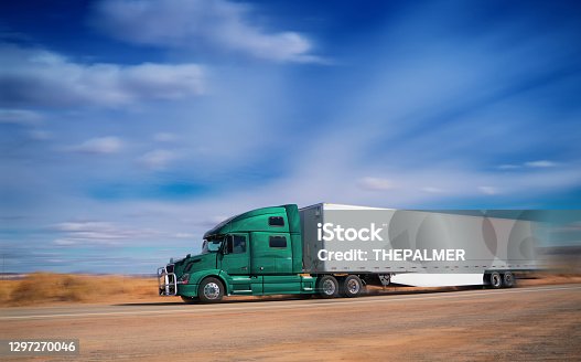 istock Semi-truck driving on a rural road in Arizona USA 1297270046