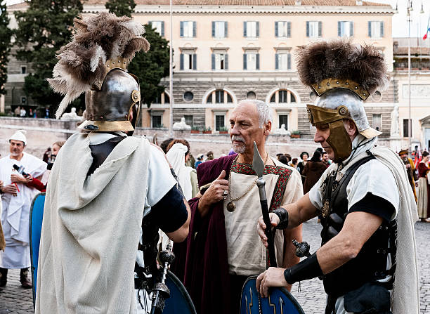 Senator and Legionaries Rome, Italy - February 17, 2015: A Senator and two legionaries waiting for the Carnevale Romano 2015's parade to begin.  horse mask photos stock pictures, royalty-free photos & images