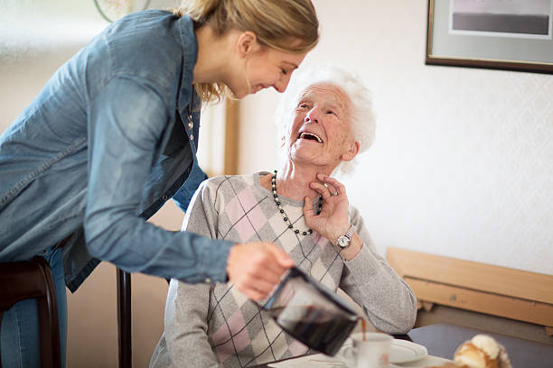 senior adult getting care and assistance stock photo