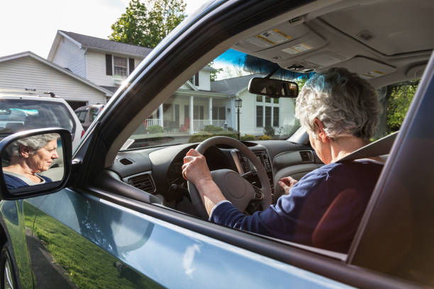 Senior Adult Woman Learning New Car Controls and Features stock photo