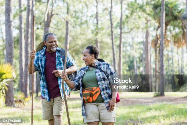 Senior African-American couple hiking in park