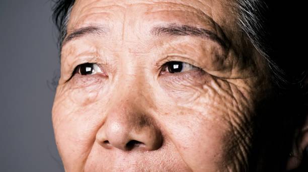Senior asian woman eye Senior asian woman eye human body macro stock pictures, royalty-free photos & images