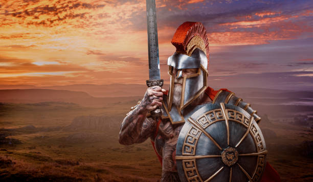A senior bearded Warrior Gladiator holding a fiery weapon A modern, superhero, comic book re-interpretation of a senior bearded Warrior Gladiator holding a weapon armour of god stock pictures, royalty-free photos & images