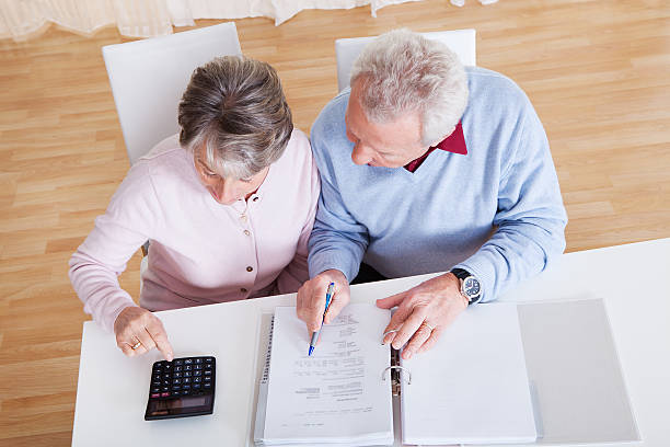 senior couple calculating budget - retirement overview bildbanksfoton och bilder