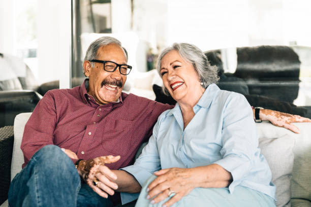 Senior couple flirting on the porch stock photo