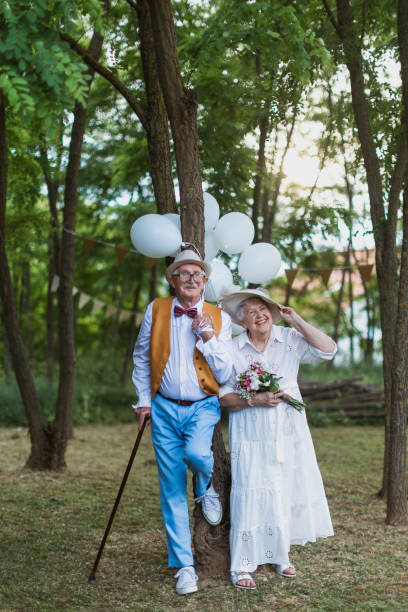 Senior couple having marriage in nature during summer day. stock photo