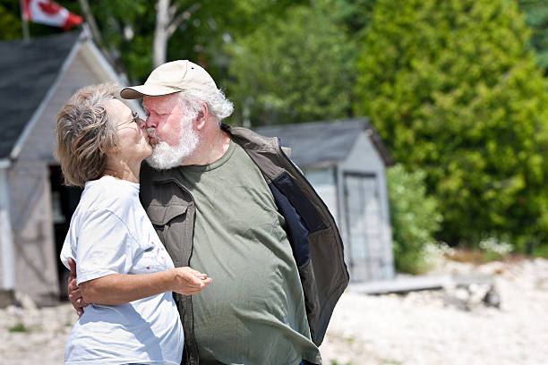 Senior couple kissing stock photo