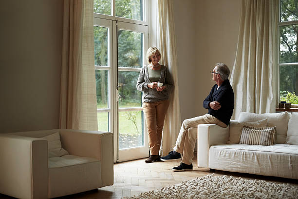 senior couple looking at each other - pensioen nederland stockfoto's en -beelden