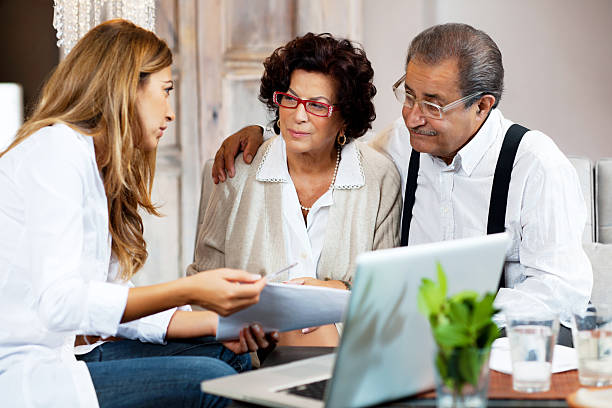 Senior couple meeting with financial advisor. tax attorney stock pictures, royalty-free photos & images