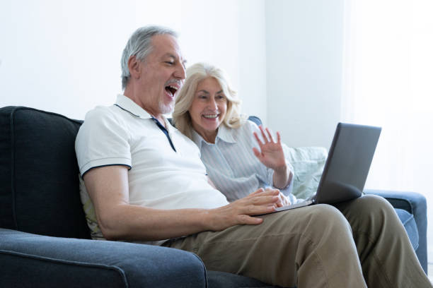 Senior Couple Video Calling Family and Friends stock photo