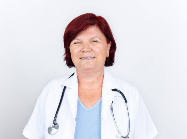 Senior female doctor. Portrait of beautiful mature female doctor looking at camera. Medical concept stock photo