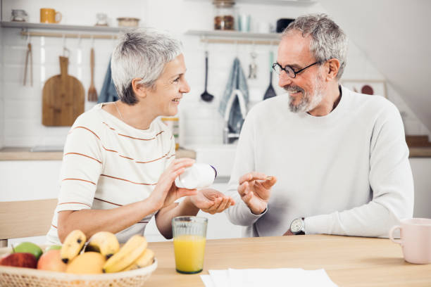 Senior man and woman taking care of their health stock photo