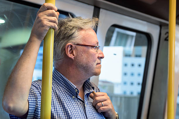 senior man in the metro - subway snapshot stockfoto's en -beelden