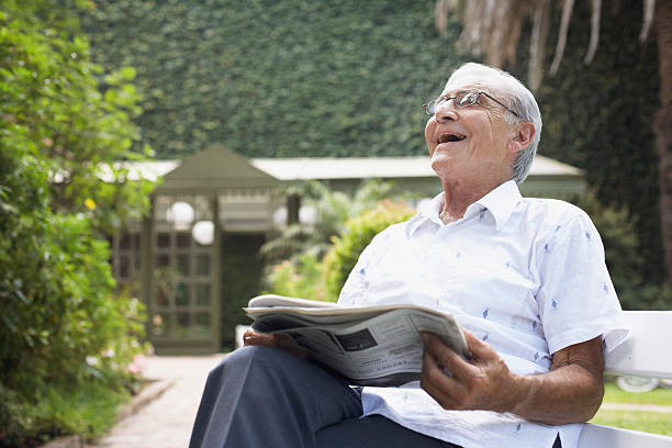 https://media.istockphoto.com/photos/senior-man-sitting-outdoors-with-newspaper-laughing-picture-id81725034?k=20&m=81725034&s=612x612&w=0&h=YM9vPiAYmUd9r8fjyzXtK3eMNniRNgTjg3E7H0OdE_o=