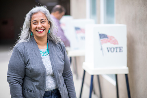 A beautiful senior mexican woman at the voting booth