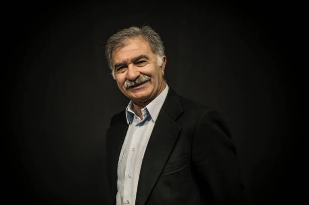 Senior Turkish Man Portrait on Black Background stock photo