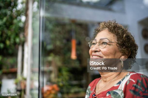 Senior woman contemplating at home
