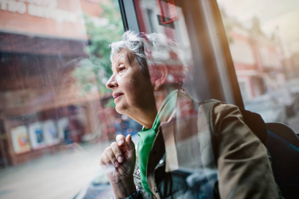 Senior woman in the bus stock photo