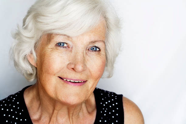Senior woman portrait Beautiful senior woman portrait, outdoor on grey background good looking older women pictures stock pictures, royalty-free photos & images