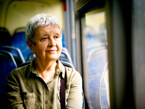 Senior woman traveling by bus stock photo