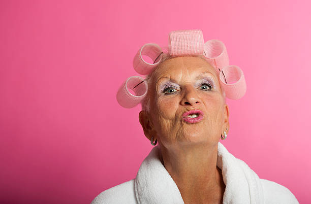Senior woman with curlers "Senior woman, 70 years old, with curlers in her hair.Other photos of this model:" ugly old women stock pictures, royalty-free photos & images