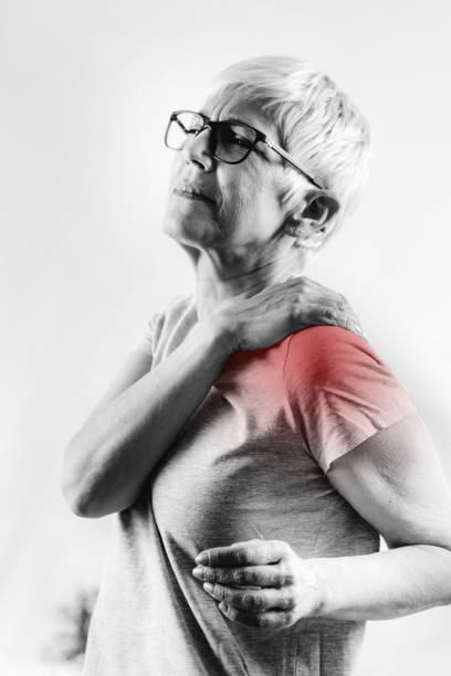 Senior Woman with Shoulder Pain stock photo