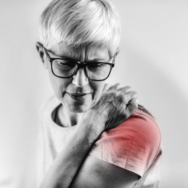 Senior Woman with Shoulder Pain stock photo