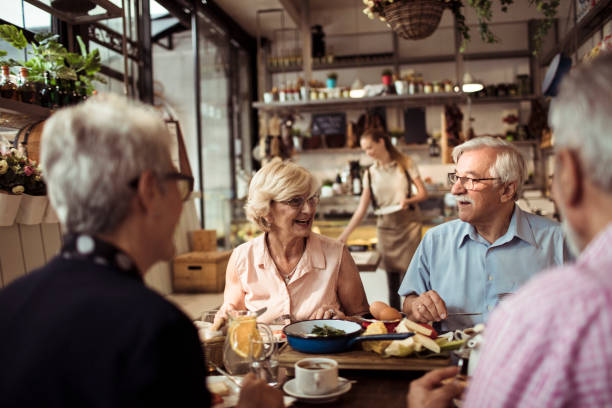 Seniors in a restaurant stock photo