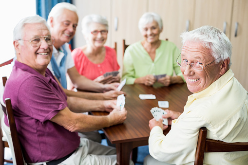 Seniors Playing Cards Together Stock Photo - Download Image Now - iStock