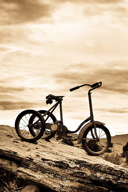 Sepia Antique Bicycle Old fashioned cycle adult tricycle stock pictures, royalty-free photos & images