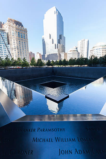 September 11 Memorial in Manhattan, NYC New York City, US - October 06, 2015: National September 11 Memorial in Lower Manhattan. It commemorates the September 11, 2001, attacks, which killed 2,977 victims, and the World Trade Center bombing of 1993, which killed six.  911 memorial stock pictures, royalty-free photos & images