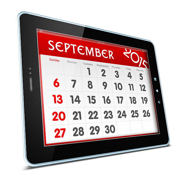 September 2015 Calender on digital tablet isolated on white background