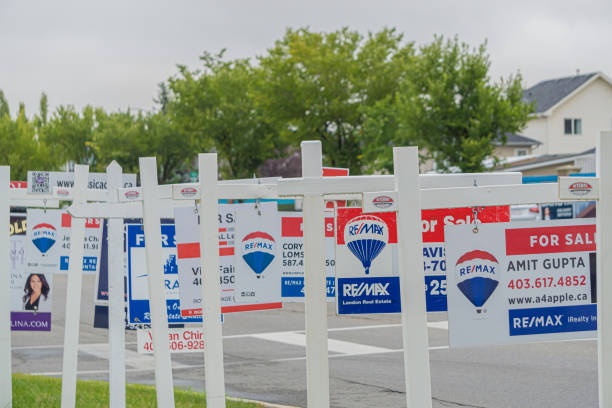 11 September 2020 - Calgary Alberta Canada - Real estate for sale signs on a street stock photo