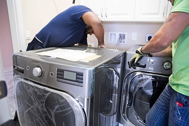 Series- Real installation of washer and dryer in laundry room stock photo