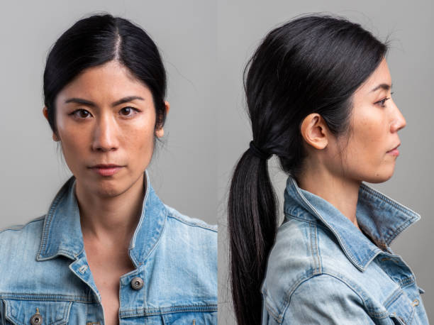 Serious asian mid adult woman front and profile mugshots stock photo