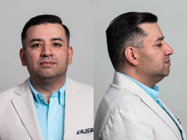 Serious hispanic mature man front and profile mugshots stock photo