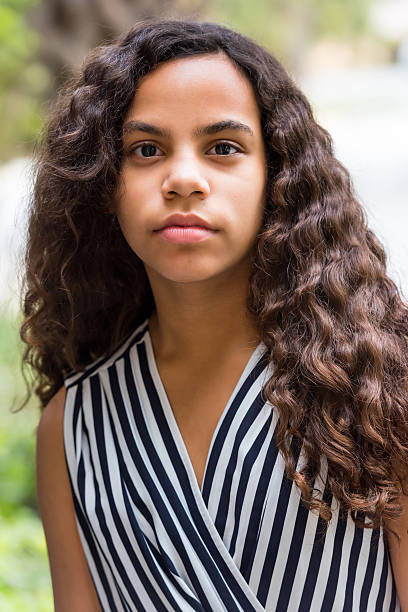 Serious hispanic teenage girl Serious hispanic teenage girl looking at the camera cute puerto rican girls stock pictures, royalty-free photos & images