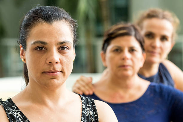 Serious Mature Women Three hispanic or middle eastern mature women posing looking at the camera serious immigrant stock pictures, royalty-free photos & images
