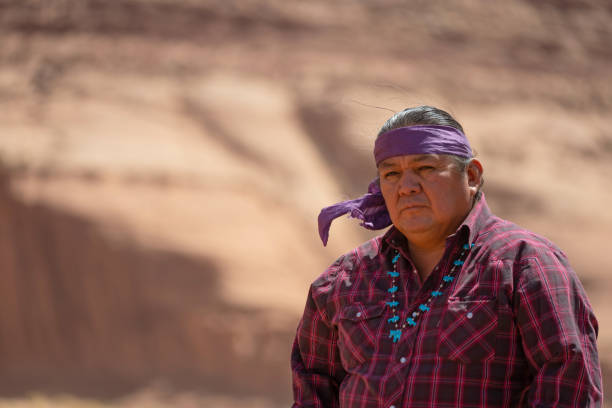 Serious Navajo man portrait in Monument Valley stock photo