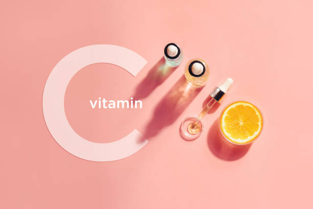 Serum with vitamin C, concept design. Beauty therapy, body care. Minimalism Flat lay. stock photo