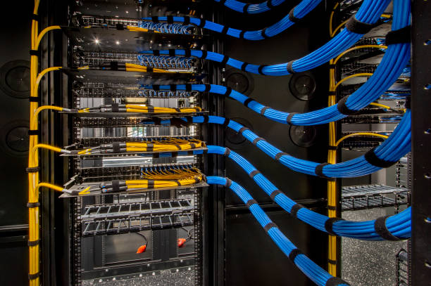 Server Room Wiring Fiber Optic and Cat 6 wiring in a server room. wire stock pictures, royalty-free photos & images