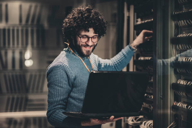 Server Rooms-IT engineer at workplace stock photo