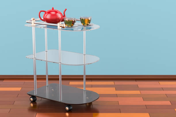 Serving cart with cups of tea and teapot. 3D rendering Serving cart with cups of tea and teapot. 3D rendering push cart stock pictures, royalty-free photos & images
