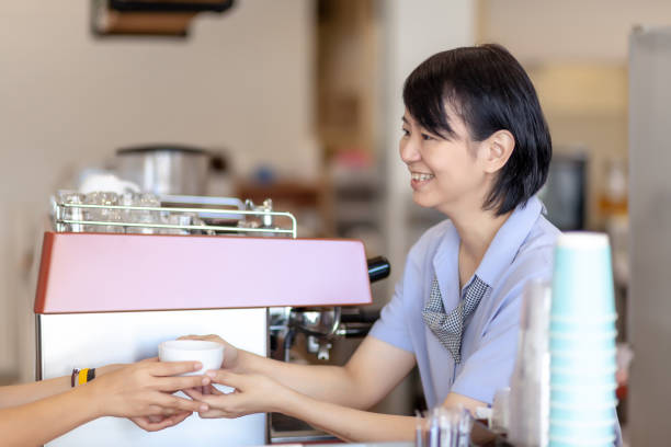 Serving coffee with happiness smile stock photo